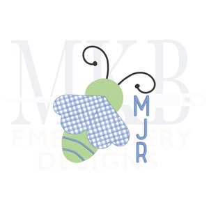 May include: A green and blue bee with a checkered pattern on its wings. The bee has a black head with two antennae. The bee is surrounded by the text "MKB Embroidery Designs" and the letters "MJR".