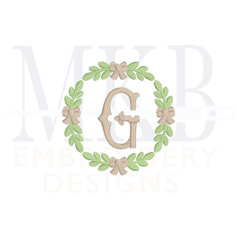 May include: A monogram design featuring the letter "G" in a brown font, surrounded by a wreath of green leaves and brown bows.