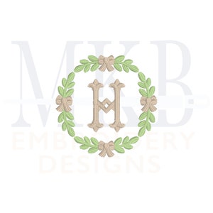 May include: A monogram design featuring the letter H in a beige colour, surrounded by a wreath of green leaves and brown bows. The wreath is circular and the letter H is centred within the wreath.