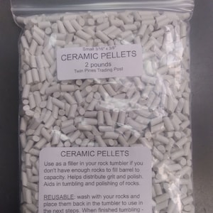 May include: A bag of white ceramic tumbling pellets, 3/16 inch by 3/8 inch, for use in rock tumblers. The bag contains 2 pounds of pellets and is labeled "Ceramic Pellets" with instructions for use.