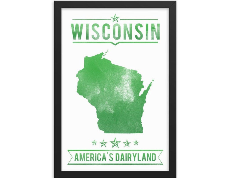 May include: A framed print featuring the state of Wisconsin in green against a white background. The word "WISCONSIN" is printed at the top, and "AMERICA'S DAIRYLAND" is at the bottom. The print is in a black frame.
