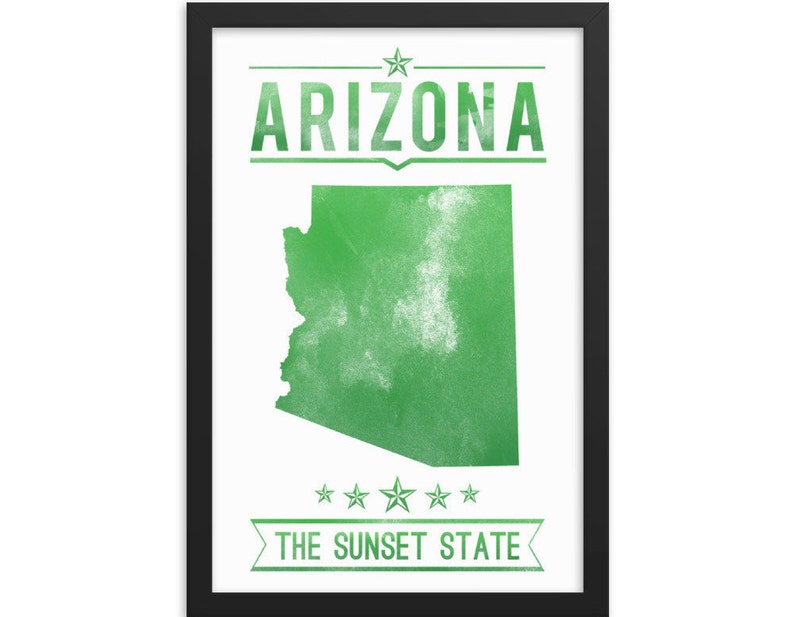 May include: Framed print featuring a green map of Arizona with the word "ARIZONA" above and "THE SUNSET STATE" below. The text and map are in a distressed style, set against a white background within a black frame.