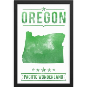 May include: A framed print featuring the state of Oregon in green, with the word "OREGON" above the state outline. Below the outline, the text reads "PACIFIC WONDERLAND". The print is in a black frame.