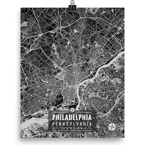 May include: Black and white map print of Philadelphia, Pennsylvania, with street and road details. The city map includes the text "PHILADELPHIA PENNSYLVANIA" and coordinates. The print is held by a silver clip.