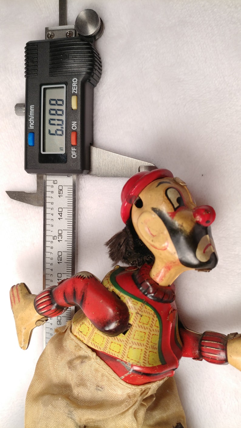 Vintage Tin toy windup Skating clown hobo