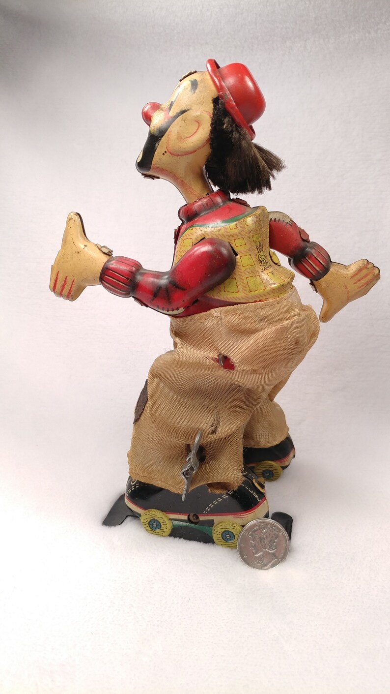 Vintage Tin toy windup Skating clown hobo