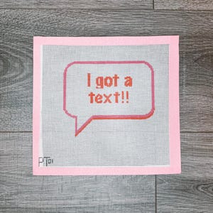 K&ouml;nnte beinhalten: Rosa Leinwand mit einer roten Sprechblase, auf der "Ich habe eine SMS bekommen!" steht.