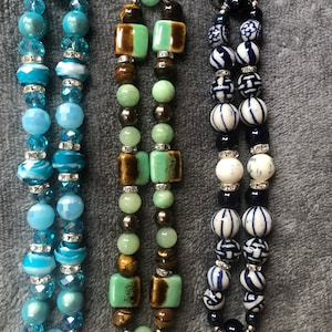 These interchangeable stretch watch bands sell for 20.00 EACH. Specify which band you prefer.