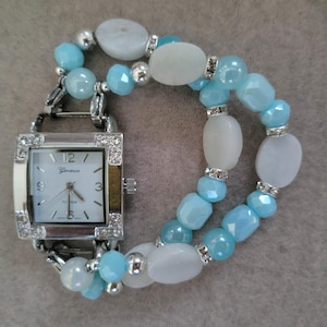 Women&#39;s delightful aquamarine interchangeable stretch watch bracelet with a square white watch face