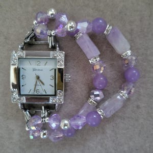 Woman&#39;s lovely lilac stretch beaded watch bracelet with square watch face.