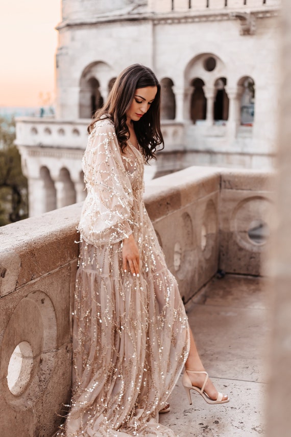 Chic Gold Sequined Maxi Dress with Flutter Sleeves Chic Gold Sequined Maxi Dress with Flutter Sleeves