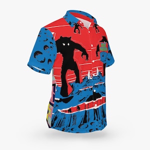 May include: Short-sleeved button-up shirt with a vibrant design. The shirt features a red background with black monster silhouettes, blue mountain-like shapes, and the text "SPACE MONSTERS". The sleeves have a blue pattern.