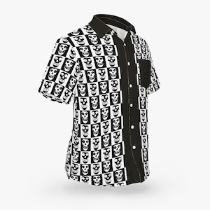 May include: Short-sleeved button-up shirt with a black and white skull pattern. The shirt has a black collar, placket, and pocket. The skull pattern is arranged in a checkerboard design. The shirt is made of a lightweight fabric.