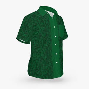 May include: A green short-sleeved button-down shirt with a black binary code pattern. The shirt has a pocket on the left side.