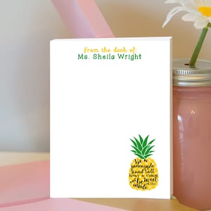 May include: White notepad with the text "From the desk of: Ms. Sheila Wright" at the top. A yellow pineapple with green leaves is at the bottom with the text "Be a pineapple Stand tall Wear a crown and be sweet inside".