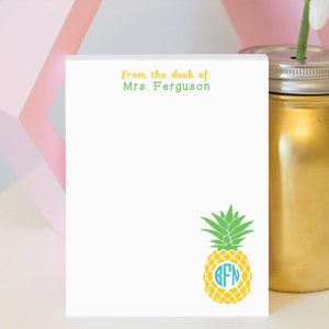 May include: White notepad with the text "From the desk of: Mrs. Ferguson" at the top. A yellow pineapple with a turquoise monogram "BFN" is at the bottom of the notepad.