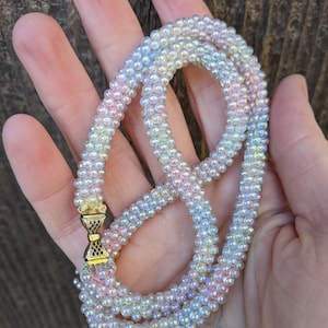 50s vintage glass rope bead necklace / pastel pink blue white yellow iridescent woven beads bow clasp / mid century Madmen sparkle gift