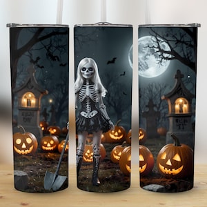 May include: A set of three stainless steel tumblers with a Halloween theme. The tumblers feature a spooky graveyard scene with a skeleton girl, pumpkins, and tombstones. The text on one of the tombstones reads "Rest in Peace".