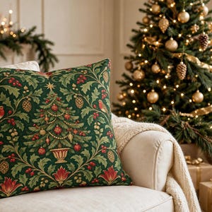 May include: A square throw pillow featuring a dark green background with a repeating pattern of a central Christmas tree in a pedestal vase, surrounded by red berries, pinecones, red flowers, and small birds with red chests and brown wings.