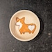 → View on Etsy: Handmade Corgi Ceramic Bowl- Dog Ring Dish – Small Speckled Stoneware Bowl – Funny Corgi Butt Gift – Whimsical Animal Pottery Handmade Corgi Ceramic Bowl- Dog Ring Dish – Small Speckled Stoneware Bowl – Funny Corgi Butt Gift – Whimsical Animal Pottery