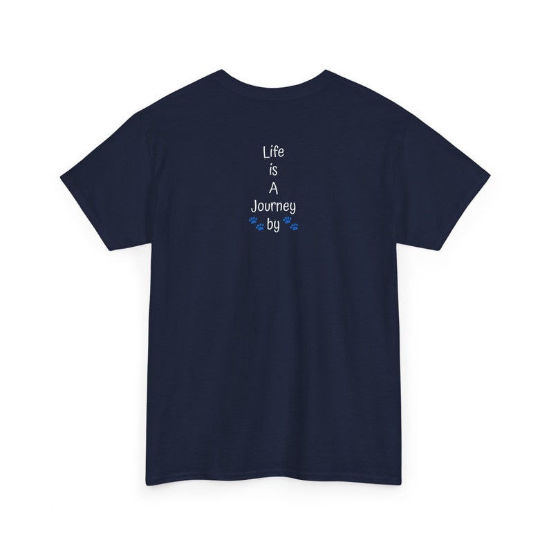 May include: Navy blue kids' t-shirt with a vertically aligned text graphic on the back. The text reads: 'Life is A Journey by' with small paw prints between 'Journey' and 'by'. The shirt is a simple, casual style, suitable for everyday wear.