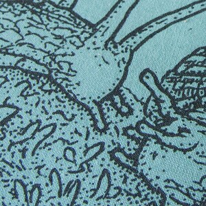 May include: A light teal fabric featuring a detailed black ink illustration of a snail with a textured shell and a long neck. The design includes intricate line work and stippling patterns that create depth and shadow across the surface of the material.