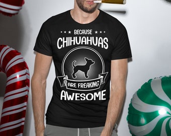 May include: A black t-shirt with a white graphic design featuring a chihuahua silhouette and the text "Because Chihuahuas Are Freaking Awesome".