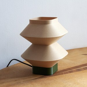 Designer Table Lamp Modern Wood Aesthetic Ambient Light Source Bedroom Reading Lamp Oak Accent Material Unique Rippled Texture Contemporary Home Decor Bedside Lighting Solution Eco Friendly Construction Biodegradable Components Stylish Desk