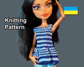 May include: Knitting pattern for a blue and white striped doll top with a pocket. The doll is wearing the top and has long black hair. The image also includes the Ukrainian flag.