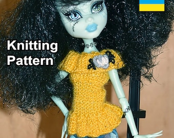 May include: Knitting pattern for a yellow doll top with a heart-shaped embellishment. The doll has black hair and green skin. The text "Knitting Pattern" is visible in the image.