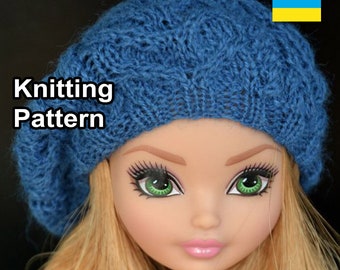 May include: A blue knitted beret with a cable knit pattern. The beret is worn by a doll with blonde hair and green eyes. The text "Knitting Pattern" is visible in the image.