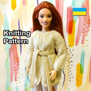 May include: Knitting pattern for a beige cardigan with a belt, designed for a doll. The doll has long red hair and is wearing the cardigan. The background is a colorful abstract pattern.