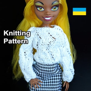 May include: Knitting pattern for a white crocheted sweater with a lacy design. The sweater is being worn by a doll with yellow hair and a black and white skirt. The text "Knitting Pattern" is visible in the image.