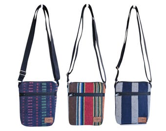 May include: Three crossbody bags with black adjustable straps. The bags feature different woven patterns in shades of blue, red, and brown. Each bag has a zippered closure and a small rectangular label.