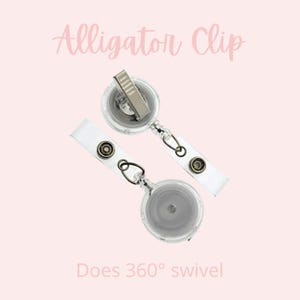 May include: Two clear retractable badge holders with alligator clips. The holders have a silver chain and a clear plastic swivel that rotates 360 degrees. The text "Does 360&deg; swivel" is printed below the holders.