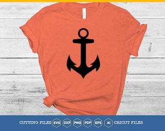 May include: A black anchor graphic on a coral colored t-shirt. The t-shirt is laying flat on a white wood background.