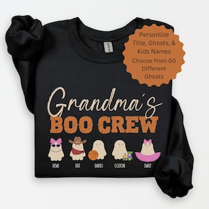 May include: Black sweatshirt featuring the phrase "Grandma's BOO CREW" in orange and white. Below are cartoon ghosts with names. The sweatshirt also has text that says "Personalise Title, Ghosts, & Kids Names Choose from 60 Different Ghosts."