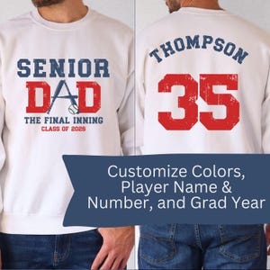 May include: White sweatshirt with blue and red text. The front reads "SENIOR DAD" with a baseball bat and ball graphic, "THE FINAL INNING CLASS OF 2026." The back displays "THOMPSON 35." The image also says "Customize Colors, Player Name & Number, and Grad Year."