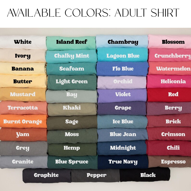 May include: A display of folded adult shirts in various colors, including white, blue, green, and pink. The text "AVAILABLE COLORS: ADULT SHIRT" is at the top, with color names like "White," "Chambray," and "Blossom" displayed on each shirt.