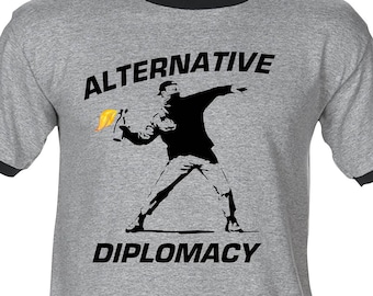 ALTERNATIVE DIPLOMACY - Premium T-Shirt -Many Color Options -Ringers/Cottons/Blends/Tank Tops fake false news banksy inspired rage trump