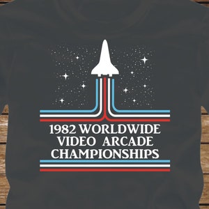 1982 WORLDWIDE VIDEO ARCADE Championship T-Shirt color ink version- fun tshirt adam sandler kevin james pixels movie atari nintendo -439