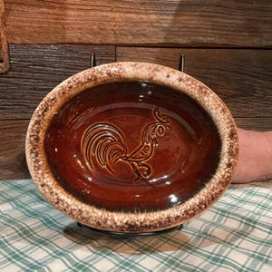 May include: A set of three ceramic mugs with a speckled, matte finish. The mugs are in shades of cream, light gray, and dark gray. Each mug has a simple, minimalist design, perfect for coffee or tea.