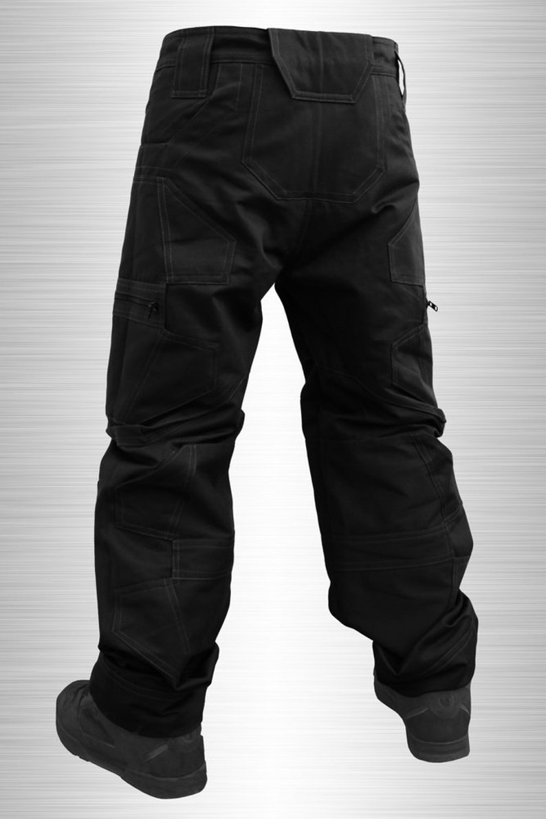 May include: Black cargo trousers with multiple pockets and a straight leg fit.