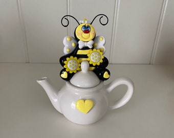 Polymer Clay Bee sitting on a Ceramic Tea Pot