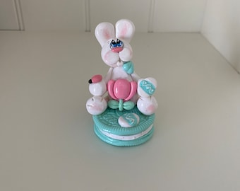 Polymer Clay Easter Rabbit sitting on a Cookie with a Tulip and Easter Eggs