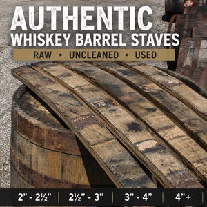 May include: Authentic whiskey barrel staves, raw, uncleaned, and used. The wooden staves are curved, weathered, and dark brown with visible grain. Text reads: AUTHENTIC WHISKEY BARREL STAVES, RAW &bull; UNCLEANED &bull; USED, and 2"-2&frac12;", 2&frac12;"-3", 3"-4", 4"+ BUNG HOLE STAVES.