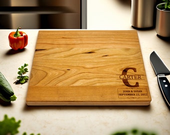 May include: A personalised wooden chopping board with the text "Carter" and "John & Susan September 23, 2012" engraved on it.
