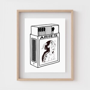 May include: A black and white illustration of a matchbox with the word "ARIES" printed on it. The matchbox features a woman with horns and a tear running down her cheek.