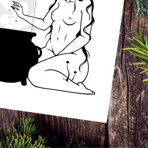 May include: Black and white line art illustration of a woman sitting with a cauldron in front of her. She is casting a spell with her hand and there are mushrooms growing on her leg.