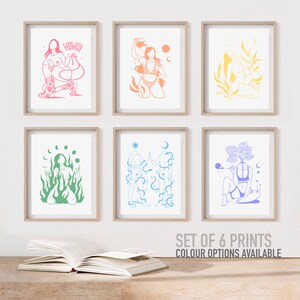 May include: Set of six prints featuring line art illustrations of figures with various symbols and designs. The prints are in different colors, including pink, orange, yellow, green, blue, and purple. The prints are framed in a light wood frame.
